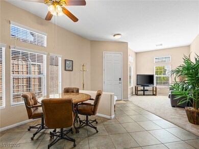 Dining space with light colored carpet, light tile