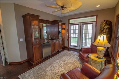 Intimate retreat with cherry cabinetry, wet bar, new refrigerator and porch entry.
