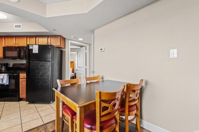 Dining area featuring light tile patterned floorin