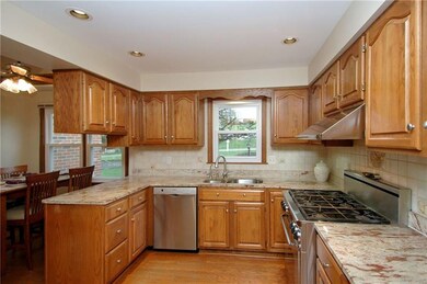 Hardwood flooring, warm oak cabinets and GORGEOUS 