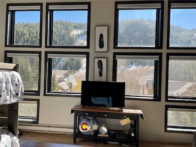 Detailed view of wood finished floors and baseboard heating