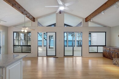 Unfurnished living room with a ceiling fan and light wood finished floors