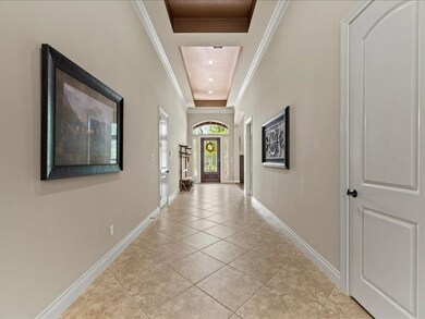 The entryway has 13' ceilings that are accented by decorative/recessed tray ceiling.