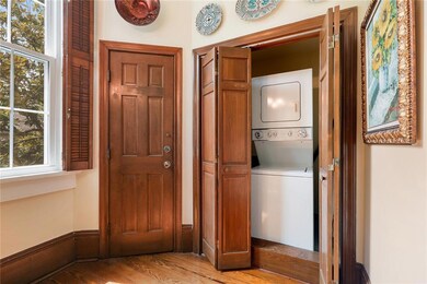 Private laundry room is conveniently located in un