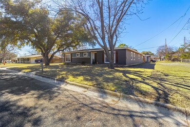 Ranch-style home featuring a front yard
