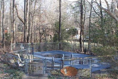 Inground pool fenced in with nice cover