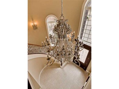 Lobby/Reception. View from top of circular stairway.  Incredible chandelier.