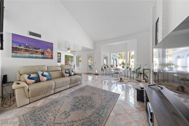 Living room featuring high vaulted ceiling, health