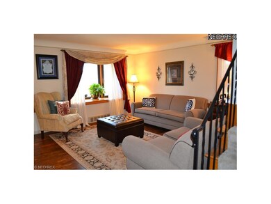 Formal Living Room with Wood Floors, Bay Window an