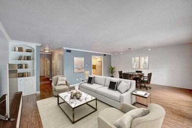 Virtually staged. Family Room with accent brick wa