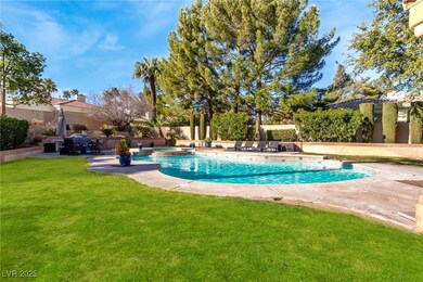 View of pool with a fenced backyard, a pool with c