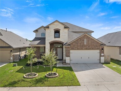 French provincial home with brick siding, a shingl