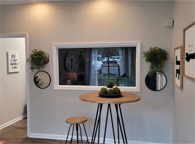 Kitchen with dark hardwood / wood-style flooring