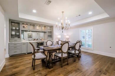 Elegant Dining Room features French Oak floors, ra