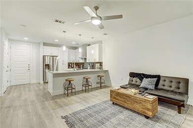 Living room featuring light wood-type flooring, a