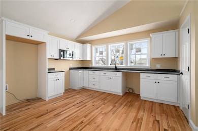 Large kitchen area with granite counters and plent