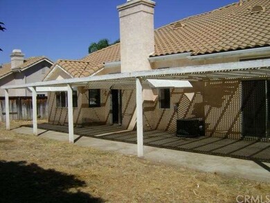 View of back yard and patio. 