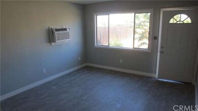 Good size living room with new flooring, baseboard