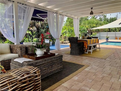 Fenced backyard featuring a patio, outdoor lounge area, a ceiling fan, and outdoor dining space