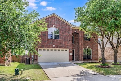 Traditional-style house with concrete driveway, a