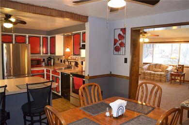 View from the dining room into the kitchen and fam