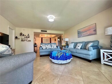 Living area featuring light tile patterned floors 