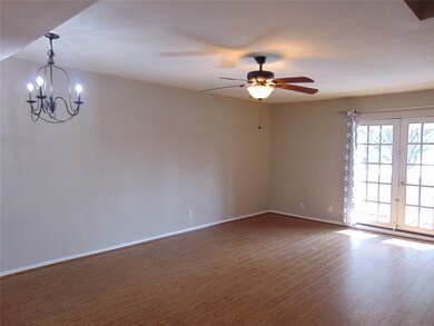 Lovely laminate floors lead to French doors and private patio with luxurious view of the beach.