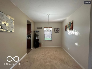 unfurnished dining area featuring light colored carpet and a chandelier