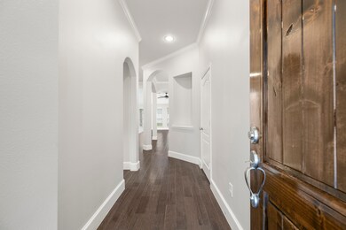 Greeted by luxurious hardwood floors.