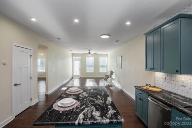 Open floorplan with stylishly remodeled Kitchen. Pantry on the left.