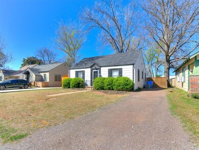 View of front facade with a front lawn and central