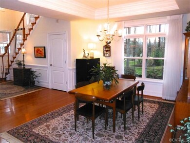 Dining room features tray ceiling with 7-member cr