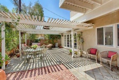 backyard and trellis covered patio off the living 