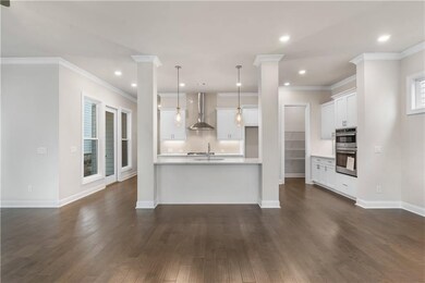 The well designed kitchen overlooks the family room and dining area.
