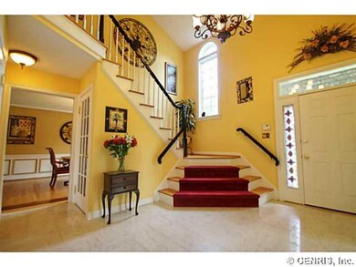 Foyer. Enter into this dramatic two-story foyer wh