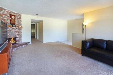 Alternate view of living room, looking from dining