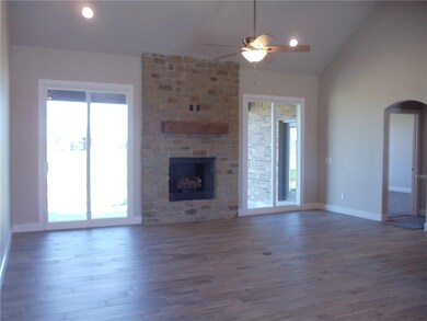 Wood style tile floors. 2 - 8' sliding back doors 