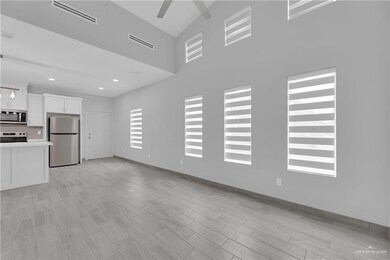 Unfurnished living room with light hardwood / wood-style floors and ceiling fan