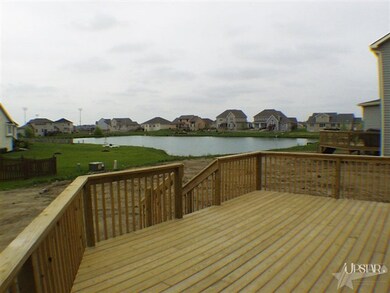 View of Pond from oversized angled deck off breakf