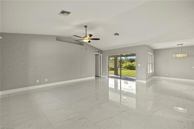 Spare room with marble finish floor, visible vents
