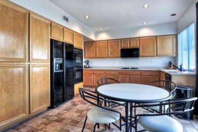 Large kitchen boasts tons of cabinet space and upg