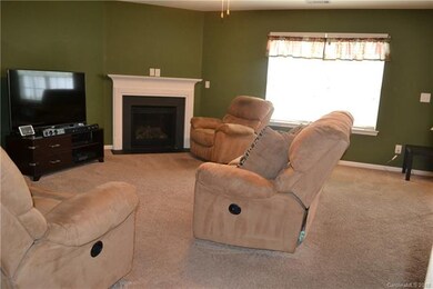 Living Room with gas fireplace w/ mantel & Slate s