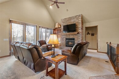 Main living area, fireplace, and sliding doors lea
