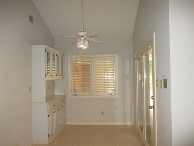 Breakfast room with built-ins and door to covered 