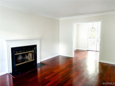 Unfurnished living room featuring dark wood-style