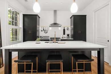 The kitchen is equipped with meticulously maintained Kitchenaid appliances