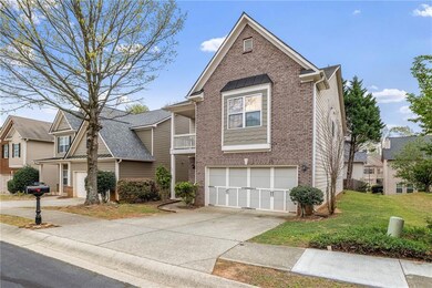 View of front of home with brick siding, driveway,
