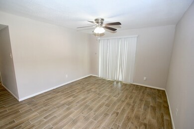 Living Area - nice and spacious. Sliding glass doo