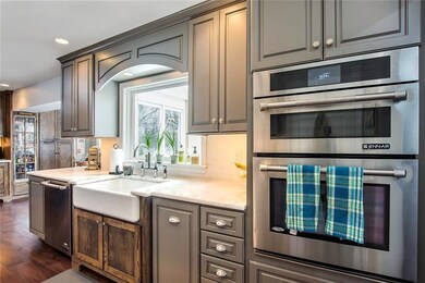 You Will Love the Mix of Grey and Stained Cabinetr