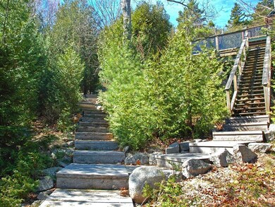 Double stairways lead to the lower...